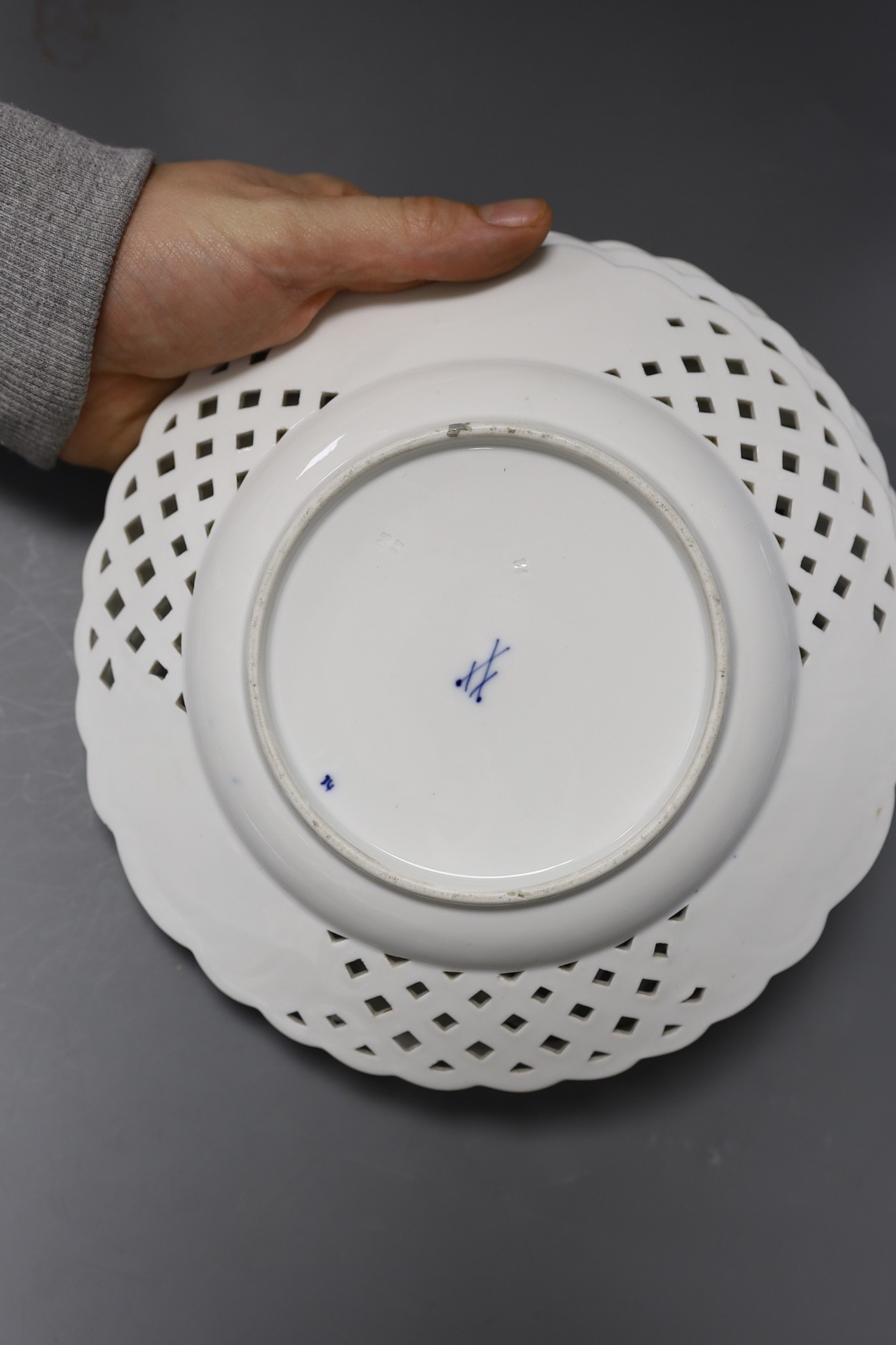 Three Meissen onion pattern plates, an 18th century Chinese exports blue and white plate and two pottery blue and white dishes, largest 27.5cm wide (5)
